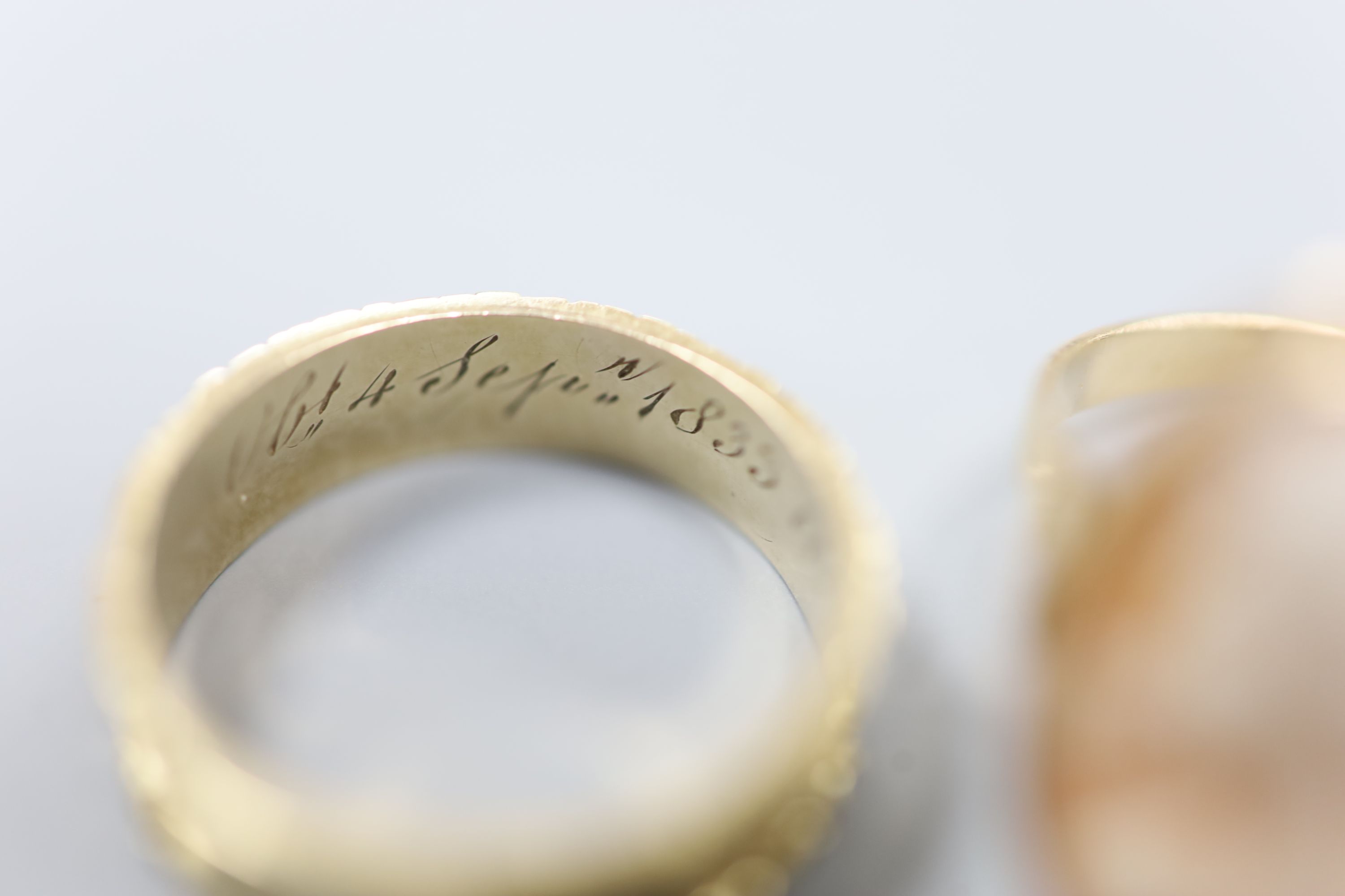 A William IV yellow metal mourning ring (lacking black enamel), with engraved initial and inscription, size M, 2.2 grams and a modern 14k and oval cameo shell ring, gross 3.2 grams.